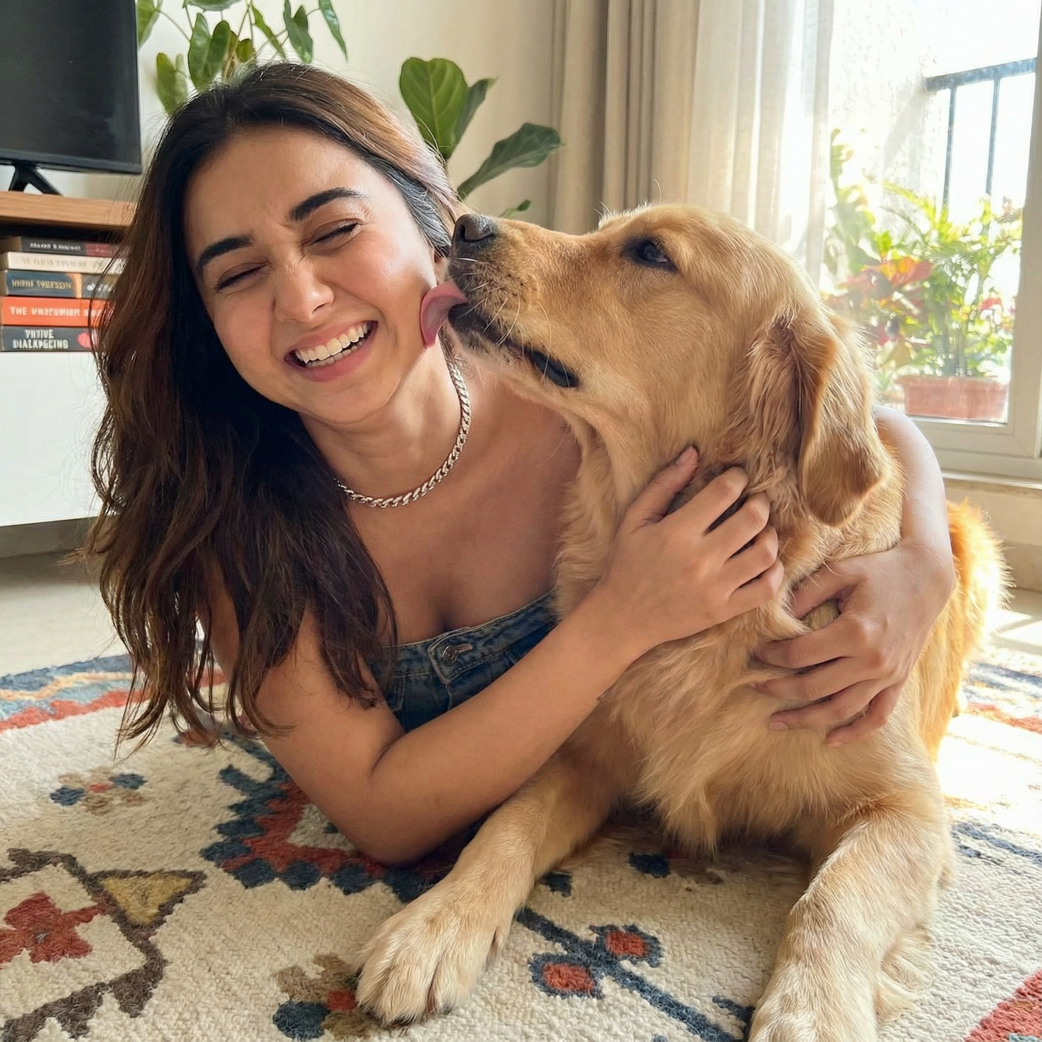 A heartwarming shot of a girl lying on a rug, laughing as her dog (or cat) licks her face. She is trying to push the pet away but is hugging it tight. Expression Cue: Eyes squeezed shut in joy. Big, toothy, genuine laugh. Double chin visible (authentic angle). Pure happiness.